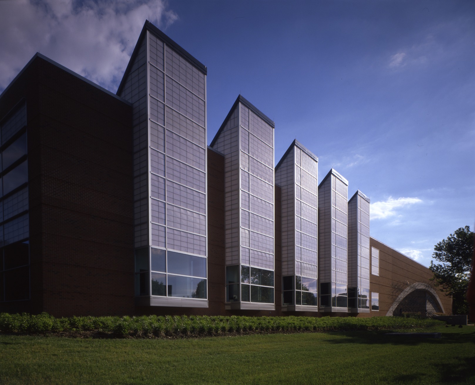 Herron School of Art + Design Five Sisters skylight façade at Eskenazi Hall, Herron School of Art and Design, featuring sawtooth glass towers and contemporary architecture in Indianapolis, Indiana.